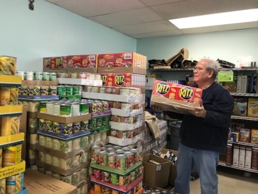 Stocking the food pantry store